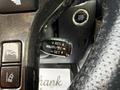 Close-up of a Toyota 4Runner steering wheel control with buttons for cruise control settings and a textured grip