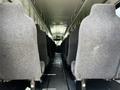 Interior view of a 2022 Blue Bird BB Conventional school bus showing rows of gray upholstered seats and aisle