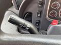 Close-up of the turn signal lever in a 2007 Freightliner B2 showing various control options including off push and pull flash settings
