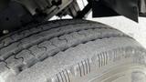 Close-up of a tire from a 2018 Mitsubishi Fuso FE showcasing tread patterns and textures