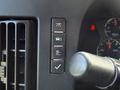 Control panel featuring buttons for headlights vehicle settings and a checkmark symbol in a 2020 Chevrolet Express