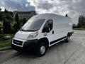 A white 2019 RAM Promaster van parked with a large cargo area and simple design featuring a black front grille and headlights