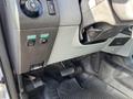 Interior view of a 2013 Ford F-250 SD with controls for lights and a brake pedal visible on the driver's side floor area