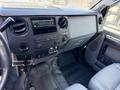 Interior view of a 2012 Ford F-450 SD showing the dashboard with audio controls and air vents