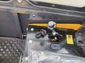 Close-up of the control panel of a 2024 AGT Industrial H13R Mini Excavator featuring a joystick, ignition key, and a digital display