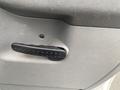 Close-up of a door handle on a 2008 Dodge Ram 5500 interior showing a textured grip for easy opening