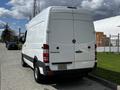 2012 Mercedes-Benz Sprinter van in white with a rear view showing the logo and model name on the back door