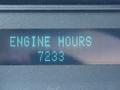 A close-up display showing the text "ENGINE HOURS" followed by the number "7233" on a 2012 Ford F-350 SD vehicle dashboard