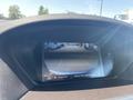 Close-up view of a rearview camera display for a 2017 Acura TLX showing guidelines and a parking area behind the vehicle