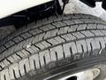 Close-up of the tire on a 2013 RAM 3500 showcasing the tread pattern and rubber surface details