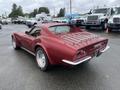 A red 1970 Chevrolet Corvette with a distinctive rear design featuring quad taillights and a luggage rack on the back