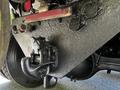 A close-up view of the rear of a 2005 Volvo VND 122 showing a heavily textured black surface with a hitch receiver and several plugs or covers mounted on the underside
