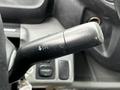 Close-up view of the turn signal lever on a 2014 Hino 195 showing the control handle and button details