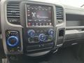 The interior dashboard of a 2019 RAM 1500 Classic featuring a touchscreen display with radio controls and climate settings