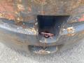 Close-up of a weathered and rusty 2010 Toyota 7FGGU25 forklift with visible signs of wear and a red release button near the base