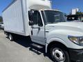 A 2014 International TerraStar truck with a white box cargo area and visible side mirrors and headlights