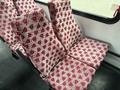 A set of red and white patterned seats from a 2015 Ford Econoline van