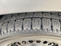 Close-up of a worn tire from a 2013 Ford Transit Connect showing tread depth and pattern
