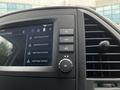Dashboard display of a 2023 Mercedes-Benz Metris showing phone connectivity options and controls for system settings