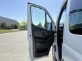 A 2023 Mercedes-Benz Sprinter with the driver's side door open showcasing the interior features and dashboard area