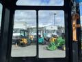 2024 AGT Industrial Green QH13R Mini Excavator viewed from inside the cabin with controls visible