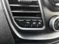 Controls on the dashboard of a 2020 Ford Transit including buttons for parking assist and drive mode selection