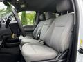 Interior of a 2020 Ford F-250 SD displaying front seating with two bucket seats and a bench seat in gray fabric