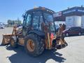 A 2008 Case Super 580M backhoe loader with a distinct yellow and black design featuring large rear tires and a front loader attachment