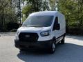 A 2021 Ford Transit van with a white exterior and black front grille is parked with no visible cargo in the back