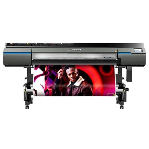 A Roland TrueVIS VG3-640 64" printer cutter displaying a vibrant image of a man in a leather jacket against an abstract background