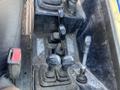 Control panel of a 2013 JCB 510-56 Loadall featuring multiple levers and joystick controls for operating the machinery