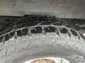 A close-up view of a 2009 Ford Econoline tire showcasing its tread pattern and rubber texture