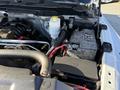 Close-up view of the engine compartment of a 2015 RAM 4500 showing the battery coolant reservoir and various engine components