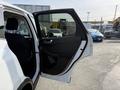 A 2020 Ford Escape with the driver's side door open showcasing the interior features and seat
