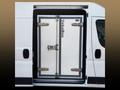 A white 2025 Ford Transit van with a large, upright double door labeled VebaBox designed for secure cargo transport