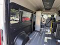 Interior view of a 2021 RAM Promaster showing seating arrangement and storage space with a focus on the driver's area and cargo floor