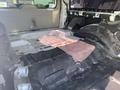 Interior view of a 2013 Ford Expedition with the rear seats removed showing the bare floor and undercarriage components