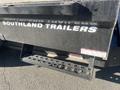 Southland 2024 18 Foot Dump Trailer with a black exterior featuring step plates for access and a safety label attached to the side