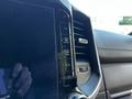 Close-up of the control panel in a 2022 RAM 3500 featuring buttons for front and rear defrost and air conditioning