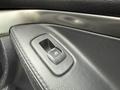 Close-up of a power window control switch on a 2019 Ford Explorer featuring a black textured surface and metallic trim
