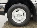 Close-up of a white wheel with a rugged Goodyear Wrangler tire on a 2014 Ford E-450 vehicle