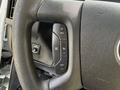 Steering wheel of a 2020 Chevrolet Express featuring control buttons for cruise setting and adjustments