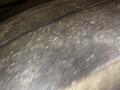 Close-up of a 2018 Grande West Vicinity tire with visible wear and small debris on its surface