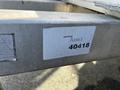 A metal frame of a 2014 Express 8 Foot Trailer with a label that reads Asset 40418