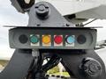 A control panel featuring five buttons labeled power overload aged push to test in a close-up view on a 2016 Ford F-550