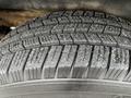 A close-up view of a tire from a 2012 Chevrolet Express showing detailed tread patterns and surface texture