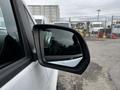 A 2018 Mercedes-Benz Metris side mirror reflecting the surroundings with a clear view