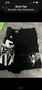 Black Tapout MMA shorts featuring a warrior design with star motifs and the Tapout logo on the sides