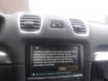 Interior dashboard of a 2016 Porsche Boxster featuring a center console with a navigation screen and various control buttons