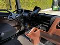 Interior view of a 2021 Hino 338 truck showing the dashboard steering wheel and control panel